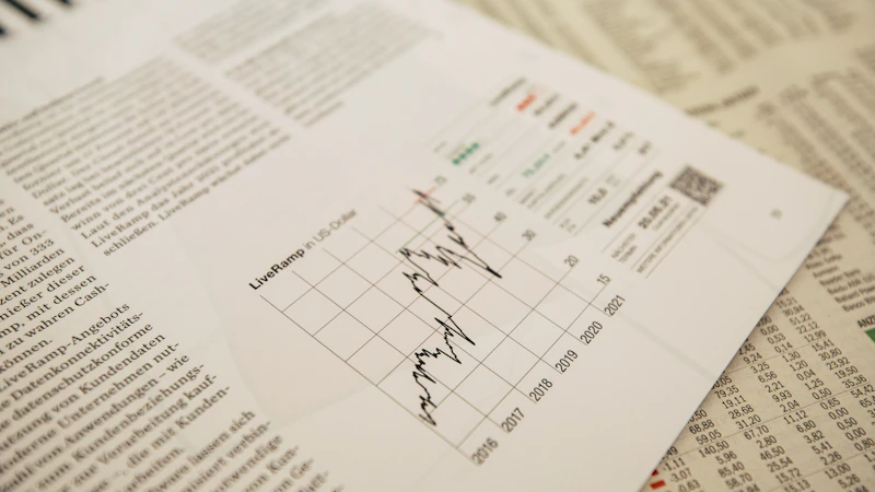 A financial newspaper with a stock chart