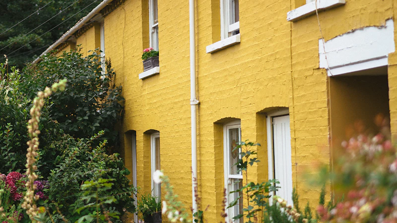 A row of yellow houses next to each other